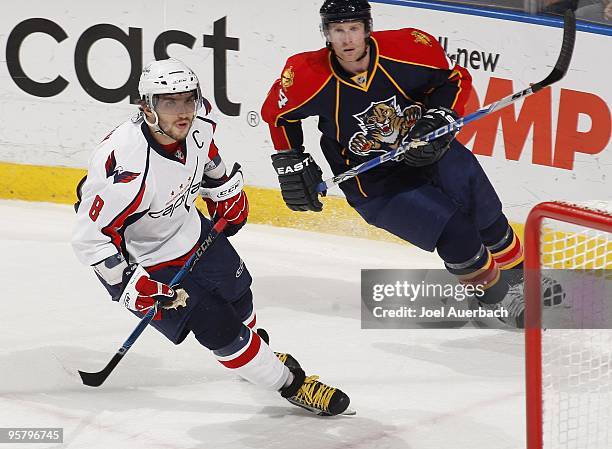Alex Ovechkin of the Washington Capitals skates away from Jordan Leopold of the Florida Panthers on January 13, 2010 at the BankAtlantic Center in...