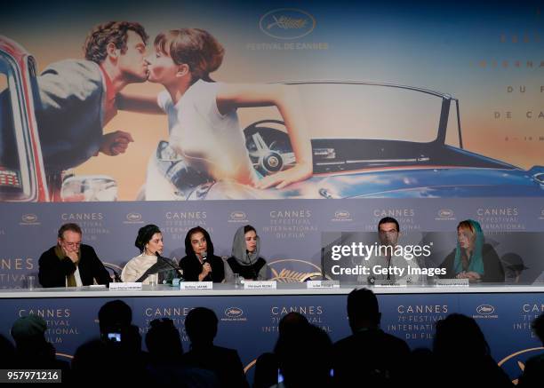 Moderator Jean-Michel Frodon, Iranian actress Behnaz Jafari, a translator, Iranian actress Marziyeh Rezaei, the empty seat of Iranian director Jafar...