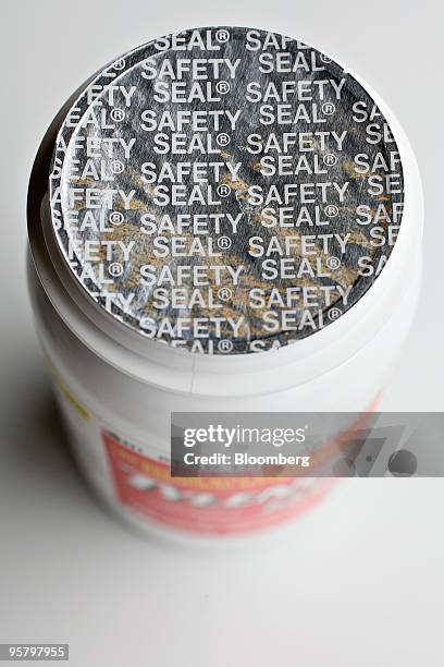 Safety seal covering the top of a recalled bottle of Tylenol Extra Strength caplets, lot AMA008, distributed by the McNeil Consumer Healthcare...