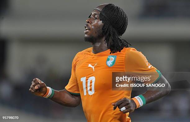 Elephant's Ivory Coast National football team striker Gervais Gervinho celebrates a goal against Black Star of Ghana during their group stage...