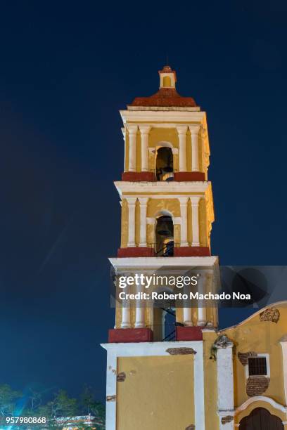 Colonial Catholic Church named Saint John the Baptist in the main plaza or town square. The landmark is a Cuban National Monument Old vintage...