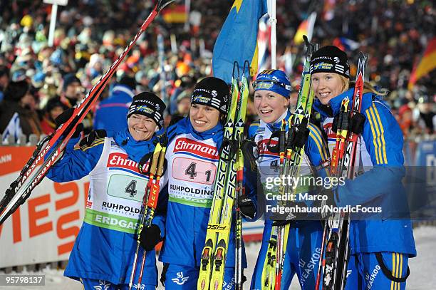 Anna Carin Olofsson, Elisabeth Hoegberg, Helena Jonsson and Anna Maria Nilsson of Sweden celebrate after winning the Women's 4 x 6km Relay during the...