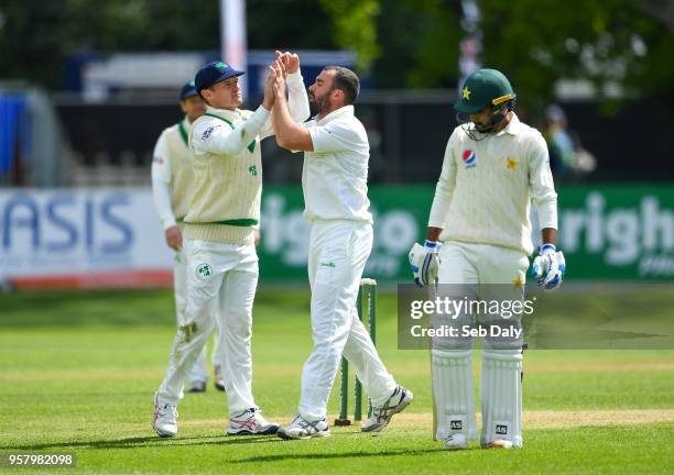 Dublin , Ireland - 13 May 2018; Stuart Thompson of Ireland, centre, is congratulated by team-mate William Porterfield after taking the wicket of...