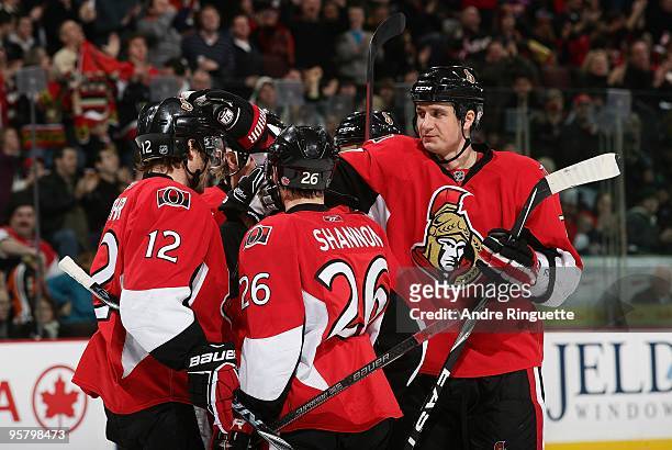 Filip Kuba of the Ottawa Senators celebrates a goal against the Philadelphia Flyers with teammates Mike Fisher and Ryan Shannon at Scotiabank Place...