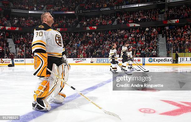 Tim Thomas of the Boston Bruins looks on during the singing of the National Anthems prior to a game against the Ottawa Senators at Scotiabank Place...