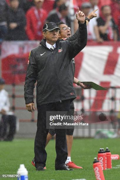 Oswaldo Oliveira,coach and Tsuyoshi Otsuki,predecessor of Urawa Red Diamonds look on during the J.League J1 match between Urawa Red Diamonds and...