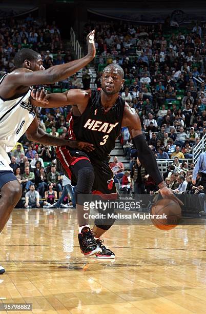 Dwyane Wade of the Miami Heat drives the ball up court against Ronnie Brewer of the Utah Jazz during the game at the EnergySolutions Arena on January...
