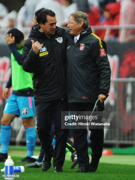 Massimo Ficcadenti,coach of Sagan Tosu and Oswaldo Oliveira,coach of Urawa Red Diamonds looks on after the J.League J1 match between Urawa Red...