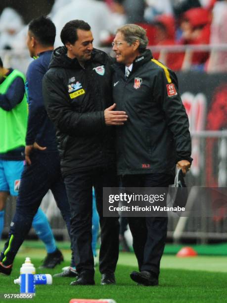 Massimo Ficcadenti,coach of Sagan Tosu and Oswaldo Oliveira,coach of Urawa Red Diamonds looks on after the J.League J1 match between Urawa Red...