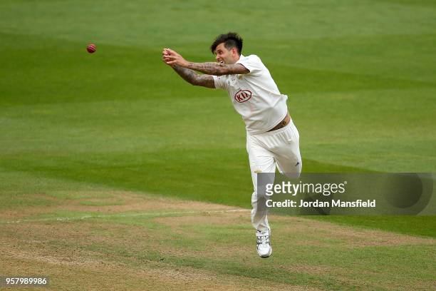 Jade Dernbach of Surrey dives for a catch during day three of the Specsavers County Championship Division One match between Surrey and Yorkshire at...