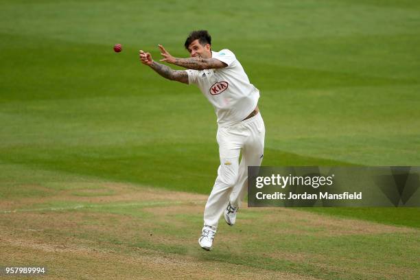 Jade Dernbach of Surrey dives for a catch during day three of the Specsavers County Championship Division One match between Surrey and Yorkshire at...