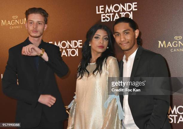 Robert Dylan, Fortas Kenza, Izir and Azougli idir attend the "Le Monde Est A Toi" Party during the 71st annual Cannes Film Festival at Magnum Beach...