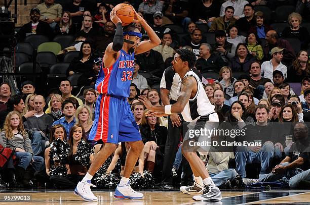 Richard Hamilton of the Detroit Pistons drives the ball against Roger Mason Jr. #8 of the San Antonio Spurs during the game on January 6, 2010 at the...