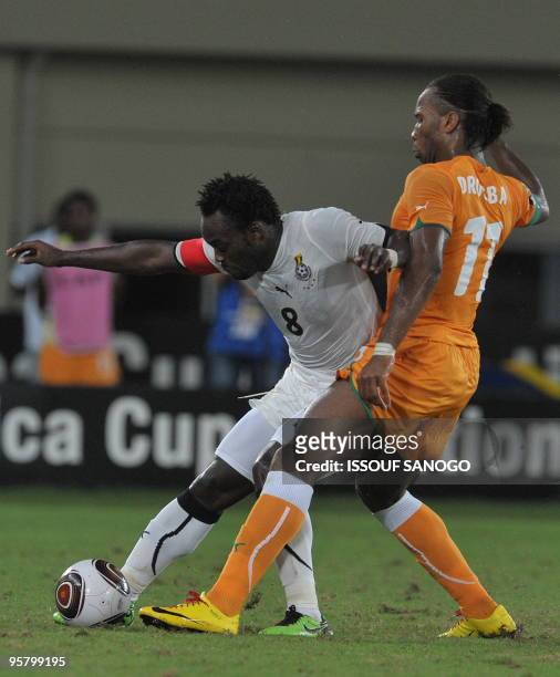 Elephant'sIvory Coast National football team striker and team captain Didier Drogba vies for the ball with Black star of Ghana captain Micheal Essien...