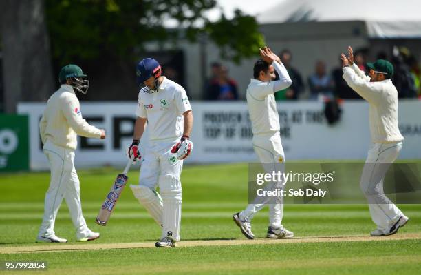 Dublin , Ireland - 13 May 2018; Ed Joyce of Ireland, second left, leaves the field, after being trapped LBW off a delivery by Mohammad Abbas of...