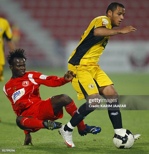 Qatar club's Brazilian midfielder Marcio Jose De Oliveira fights for the ball with Al-Arabi's player Muaaz Yousef during their Qatar Stars League...