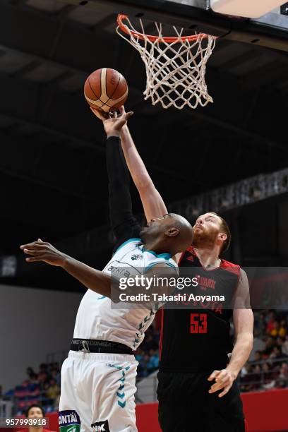 Marcus Dove of the Kyoto Hannaryz contests a rebound with Alex Kirk of the Alvark Tokyo during the B.League Championship Quarter Final Game 2 between...