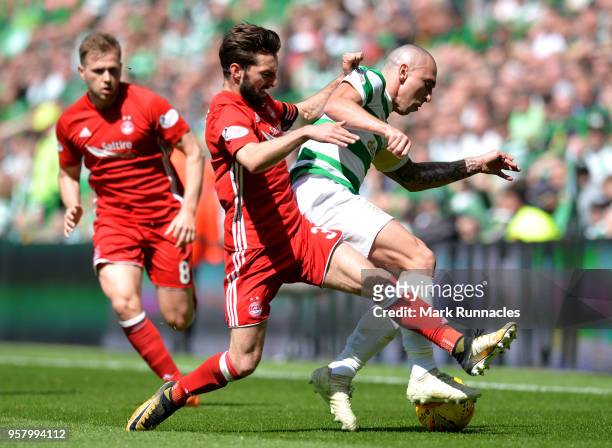 Scott Brown of Celtic and Graeme Shinnie of Aberdeen battle for possession during the Scottish Premier League match between Celtic and Aberdeen at...