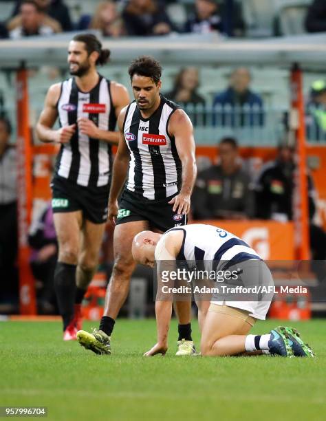 Daniel Wells of the Magpies checks on Gary Ablett of the Cats after giving him an accidental knock during the 2018 AFL round eight match between the...