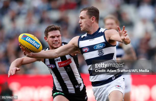 Joel Selwood of the Cats is tackled by Taylor Adams of the Magpies during the 2018 AFL round eight match between the Collingwood Magpies and the...