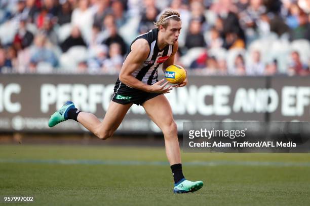 Darcy Moore of the Magpies marks the ball during the 2018 AFL round eight match between the Collingwood Magpies and the Geelong Cats at the Melbourne...