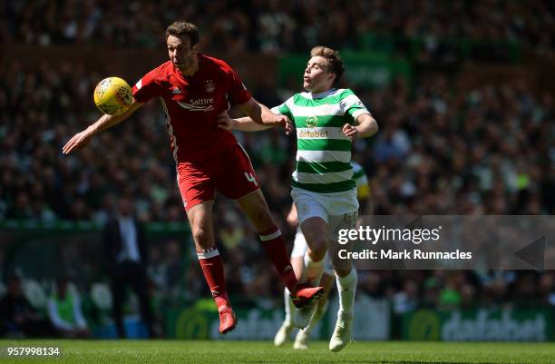 James Forrest of Celtic and Andrew Considine of Aberdeen battle for possession during the Scottish Premier League match between Celtic and Aberdeen...