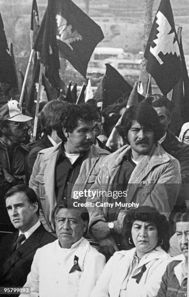 Governor Jerry Brown and labor leader Cesar Chavez sit with family and friends of Rufino Contreras during the funeral service for the slain...