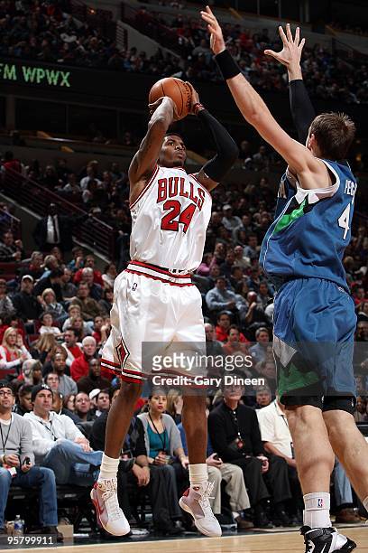 Tyrus Thomas of the Chicago Bulls shoots against Oleksiy Pecherov of the Minnesota Timberwolves during the game on January 9, 2010 at the United...