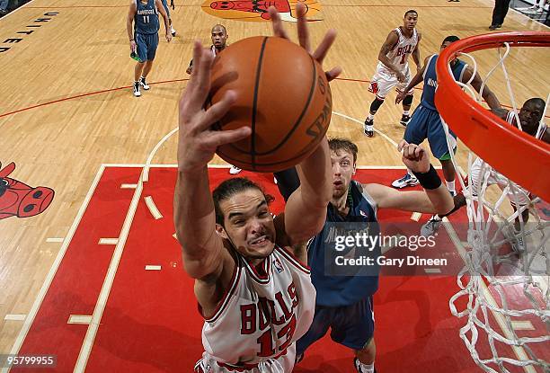 Joakim Noah of the Chicago Bulls goes to the basket against Oleksiy Pecherov of the Minnesota Timberwolves during the game on January 9, 2010 at the...
