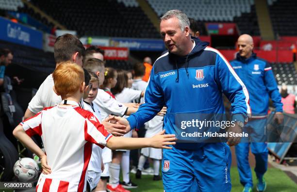 Paul Lambert, Manager of Stoke City shakes hands with fans prior to the Premier League match between Swansea City and Stoke City at Liberty Stadium...