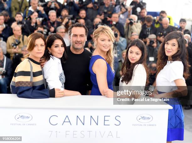 Director Gilles Lellouche poses with actresses Marina Fois, Leila Bekhti, Virginie Efira, Noee Abita and Melanie Doutey at the photocall for "Sink Or...