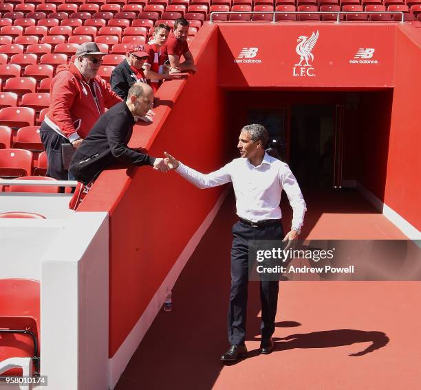 Chris Hughton of manager Brighton and Hove Albion meeting Liverpool fans before the Premier League match between Liverpool and Brighton and Hove...