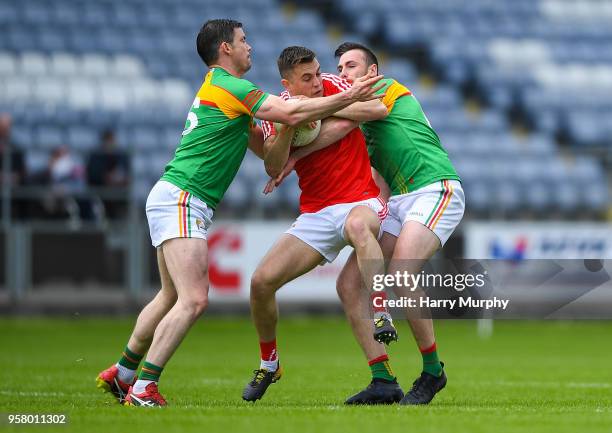 Laois , Ireland - 13 May 2018; Seán Murphy of Carlow in action against Ryan Burns and Eoghan Ruth of Carlow during the Leinster GAA Football Senior...