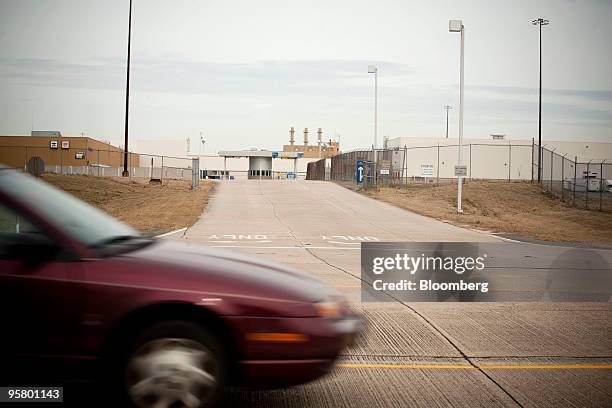 Car passes the main delivery entrance at a General Motors Co. Assembly plant in Shreveport, Louisiana, U.S., on Friday, Jan. 15, 2010. GM said it's...