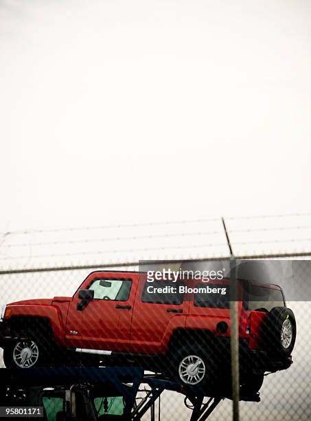 Hummer H3 vehicle sits atop a car hauler at a Union Pacific railyard adjacent to a General Motors Co. Assembly plant in Shreveport, Louisiana, U.S.,...