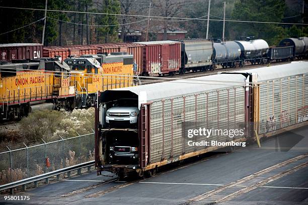 General Motors Co. Sport-utility vehicles sit in a rail car at a Union Pacific railyard adjacent to a GM assembly plant in Shreveport, Louisiana,...