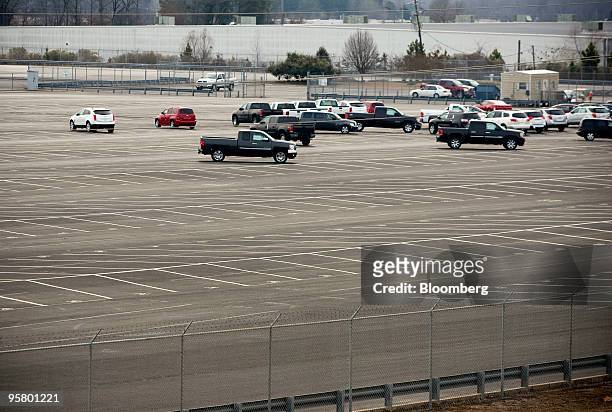 New vehicles sit in a parking lot at a Union Pacific railyard across from a General Motors Co. Assembly plant in Shreveport, Louisiana, U.S., on...