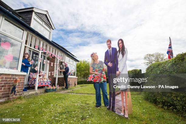 Angela and Richard Rooke and their daughter Jessica with their house near Tadcaster in Yorkshire, that they have decorated ahead of the royal wedding...