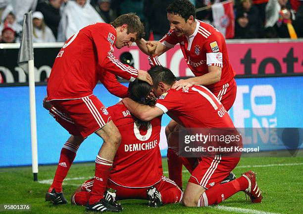 Martin Demichelis of Bayern celebrates the first goal with Holger Badstuber , Ivica Olic and Mark van Bommel a goal during the Bundesliga match...