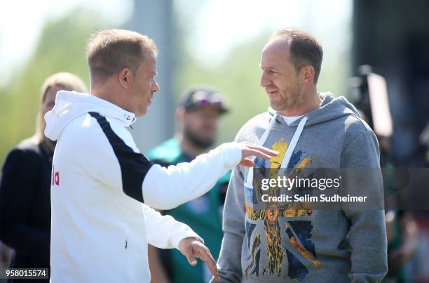 Headcoach Markus Anfang of Holstein Kiel and Headcoach Torsten Lieberknecht of Eintracht Braunschweig talk on prior to the Second Bundesliga match...