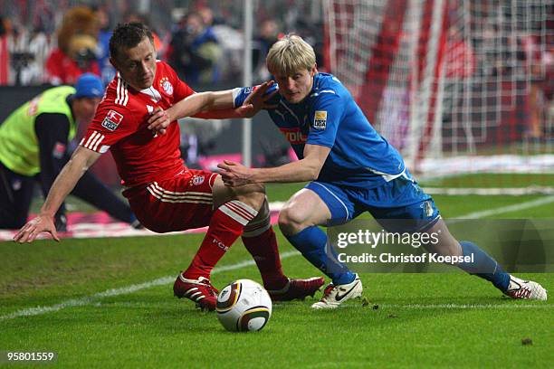 Andreas Beck of Hoffenheim tackles Ivica Olic of Bayern during the Bundesliga match between Bayern Muenchen and 1899 Hoffenheim at the Allianz Arena...