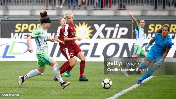 Ella Masar of Wolfsburg challenges Lisa Weiss of Essen and shoot the Goal 2:0 for Wolfsburg during the Allianz Frauen Bundesliga match between VfL...