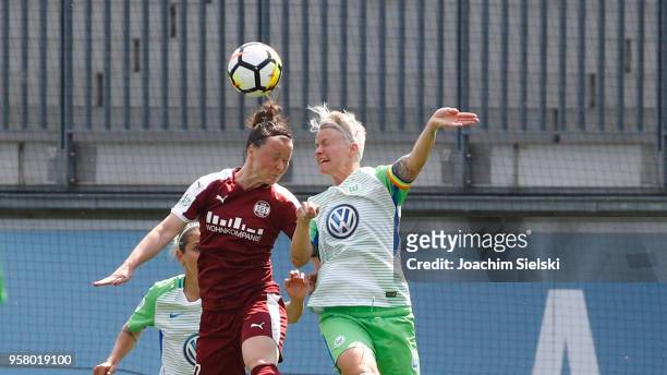 Nilla Fischer of Wolfsburg challenges Marina Hegering of Essen during the Allianz Frauen Bundesliga match between VfL Wolfsburg and SGS Essen at...