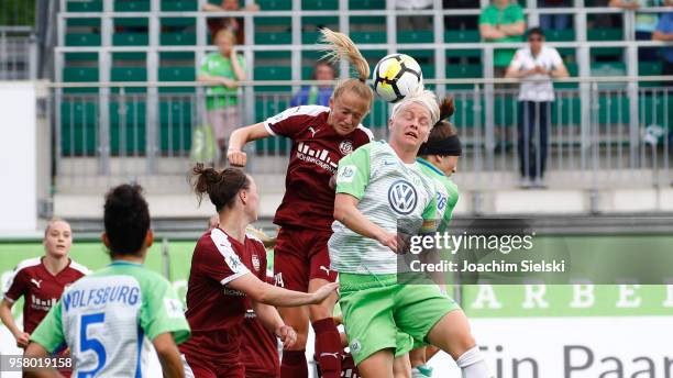 Nilla Fischer of Wolfsburg challenges Lea Schueller of Essen during the Allianz Frauen Bundesliga match between VfL Wolfsburg and SGS Essen at...