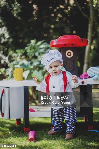 cook boy outdoors - carol cook stockfoto's en -beelden