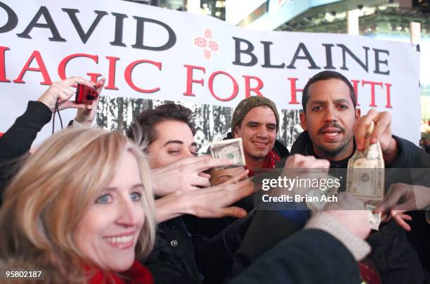 Magician David Blaine performs to help raise money for Haitian earthquake victims on Military Island, Times Square on January 15, 2010 in New York...