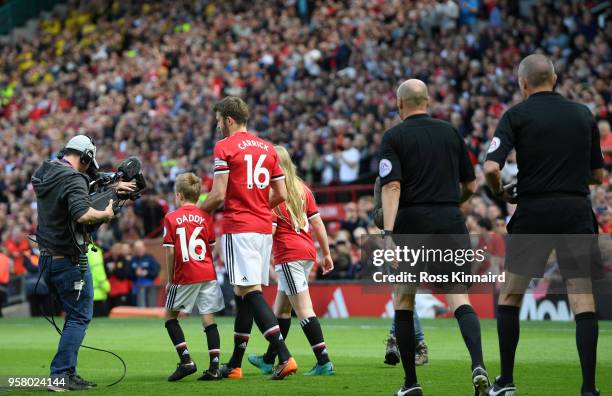 Michael Carrick of Manchester United leads out his team prior to the Premier League match between Manchester United and Watford at Old Trafford on...