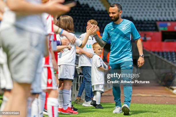 Leon Britton of Swansea City arrives prior to the game during the Premier League match between Swansea City and Stoke City at The Liberty Stadium on...