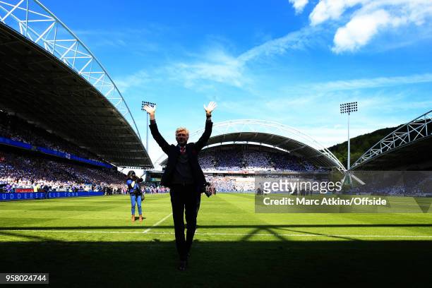 Arsene Wenger manager of Arsenal in front of the fans before his final game in charge during the Premier League match between Huddersfield Town and...