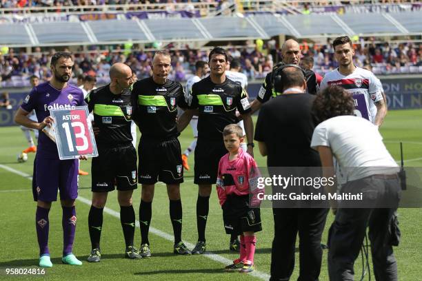 Milan Badelj captain of ACF Fiorentina and Luca Ceppitelli captain of Cagliari Calcio exchange the shirt of Davide Astori during the serie A match...